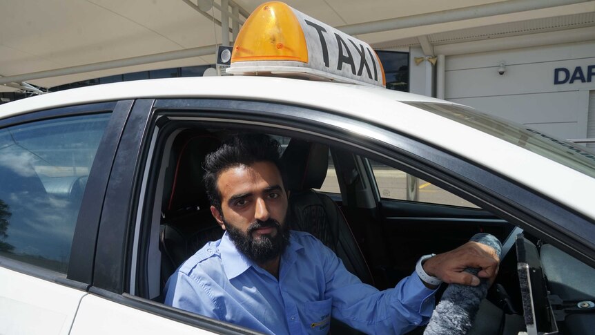 A photo of a taxi driver.