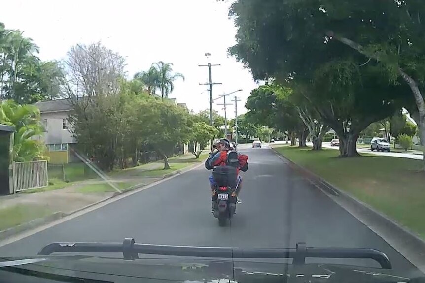 Two men on a stolen moped