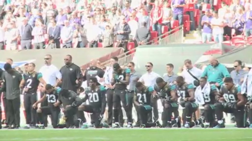NFL players take the knee during US anthem