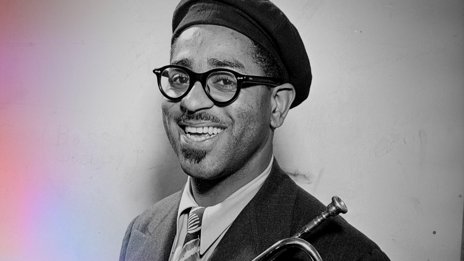 A monochrome portrait of trumpet player Dizzy Gillespie