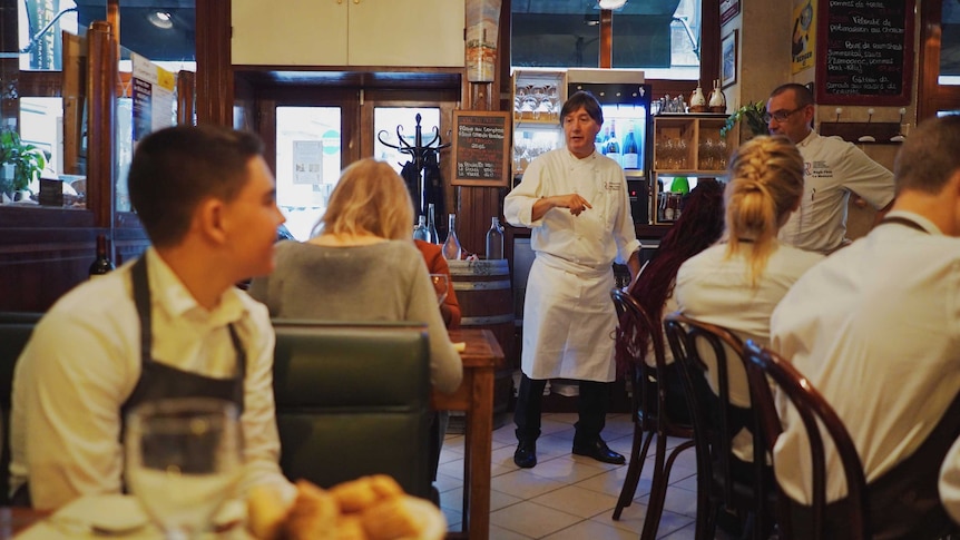Chef Alain Fontain speaks to staff in his bistro.