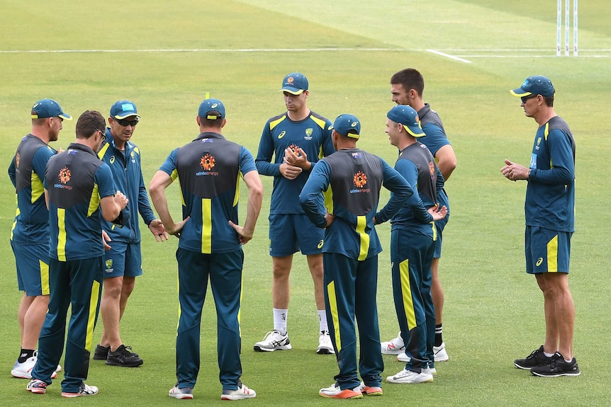 Cricket coach, Justin Langer, speaks to the Australian Test players during a training session