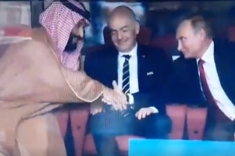 Saudi Crown Prince Mohammed bin Salman shakes hands with Russian President Vladimir Putin.