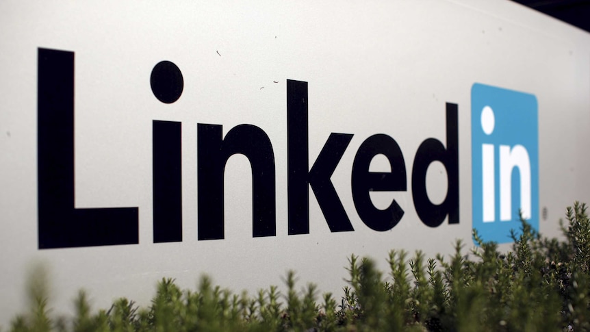 LinkedIn logo on wall in front of grass