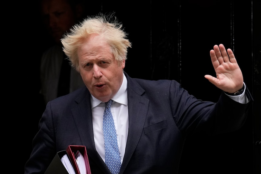 Boris Johnson waving.