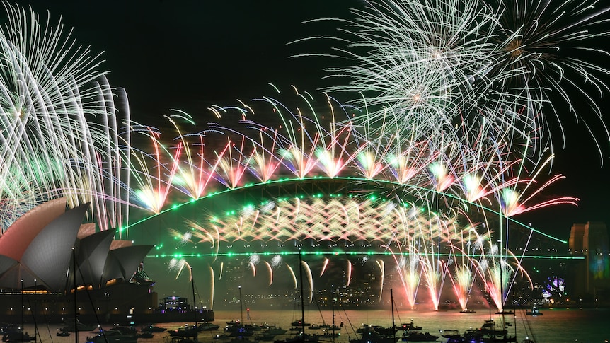 fireworks lit off on top of sydney's harbour bridge for new year celebrations