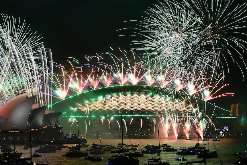 fireworks lit off on top of sydney's harbour bridge for new year celebrations