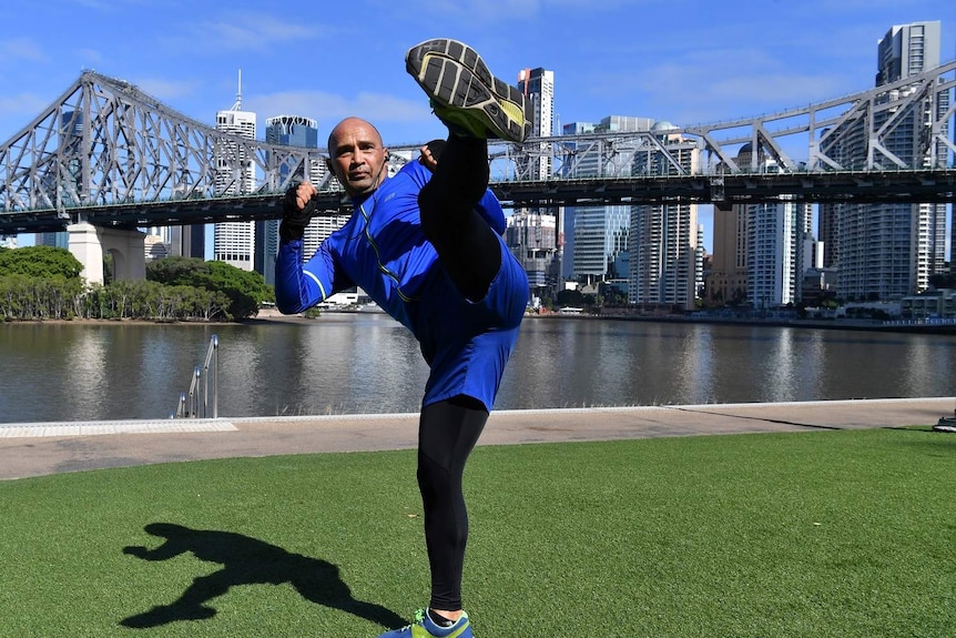 John Almstetter (left) is seen doing Martial Arts training along side the Brisbane River in Brisbane.