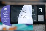 A sign on a petrol bowser saying "no fuel".