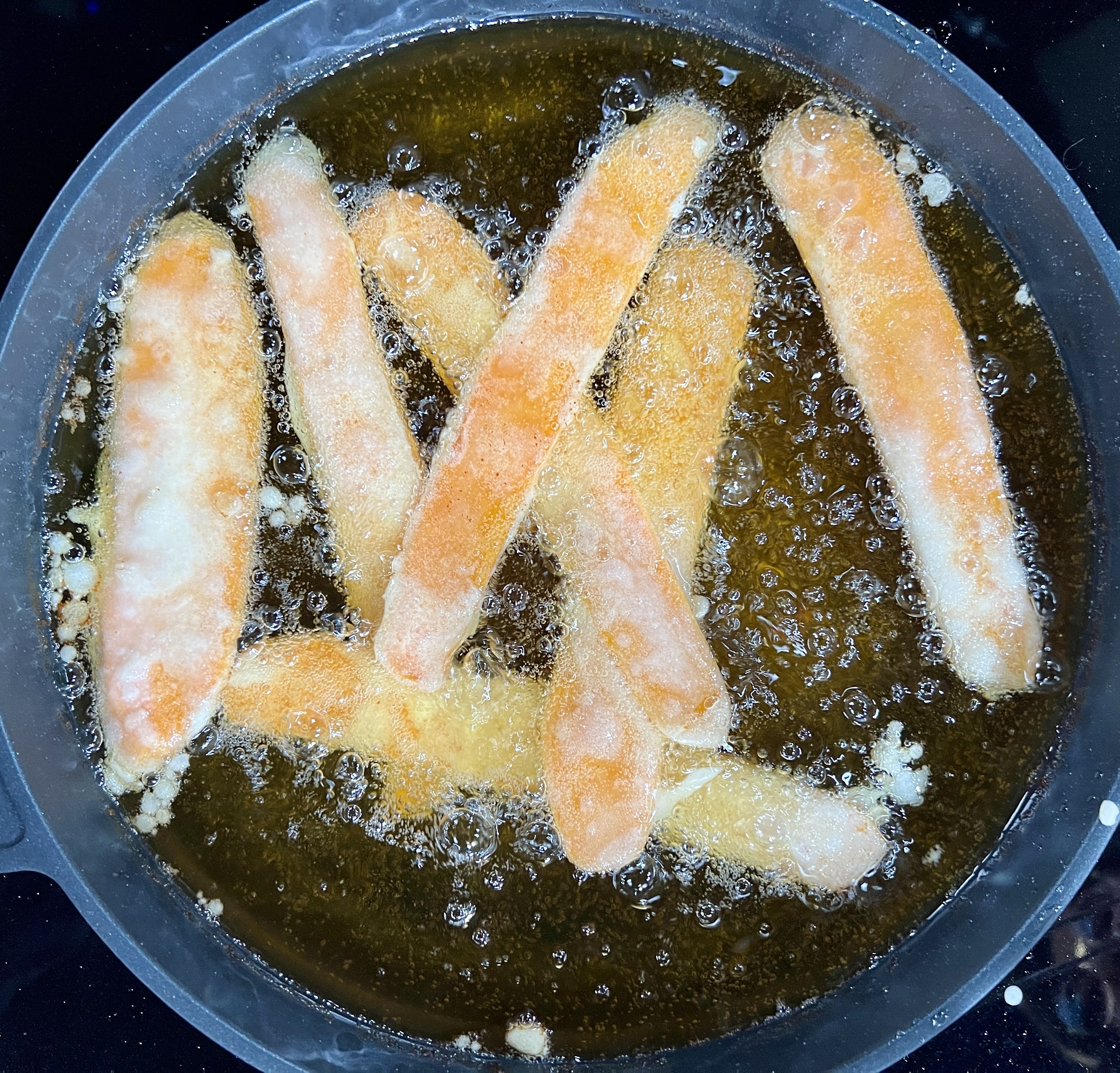 battered, sweet potato frying in oil
