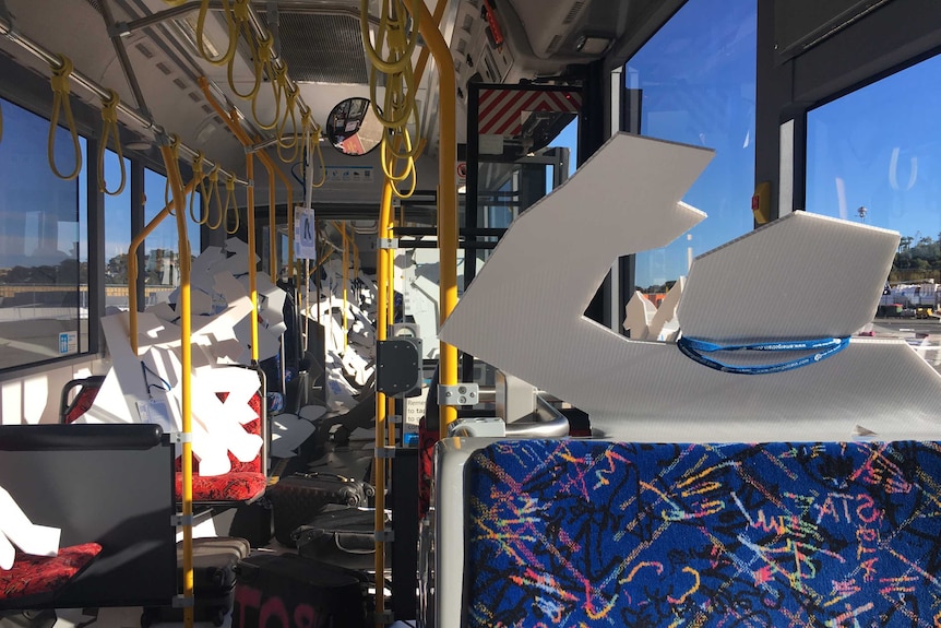 Cut outs of victims on the bus.