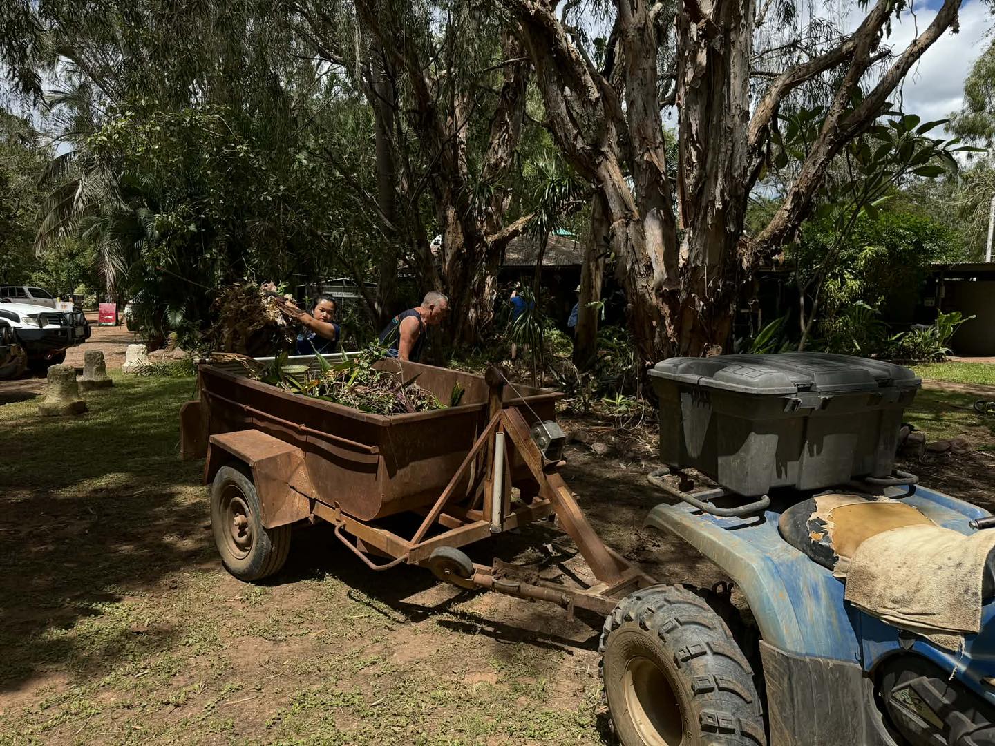People picking up flood debris