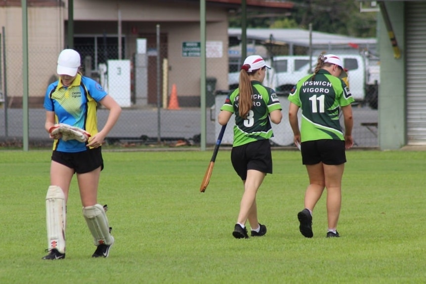 Women in sport uniform walk off field