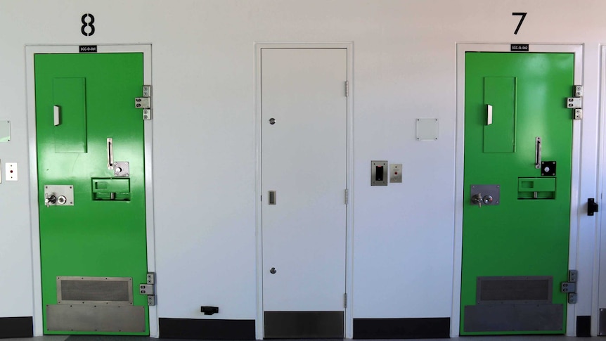 Green cell doors in the Special Care Unit at the Alexander Maconochie Centre.