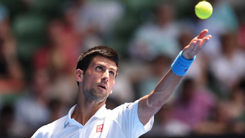 Steely focus ... Novak Djokovic serves to Andrey Kuznetsov