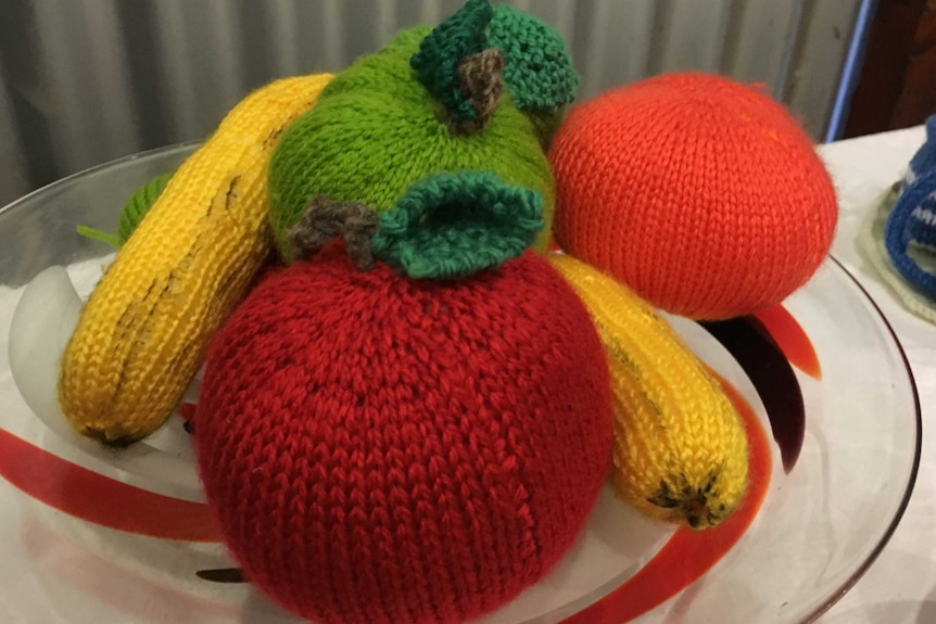 Knitted banana and knitted strawberry.