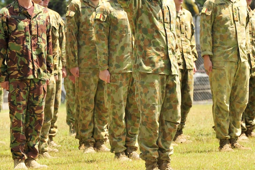 Australian soldiers stand to attention in East Timor in 2009.