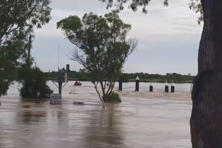 A boat on flooded Groper Creek