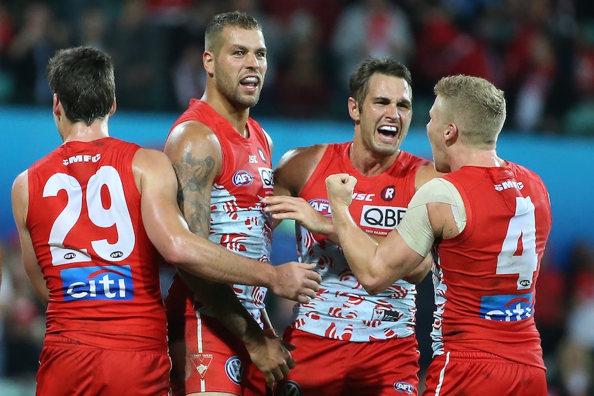 Lance Franklin celebrates a goal for the Sydney Swans against Hawthorn.