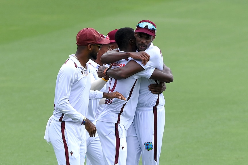 West Indies players hug