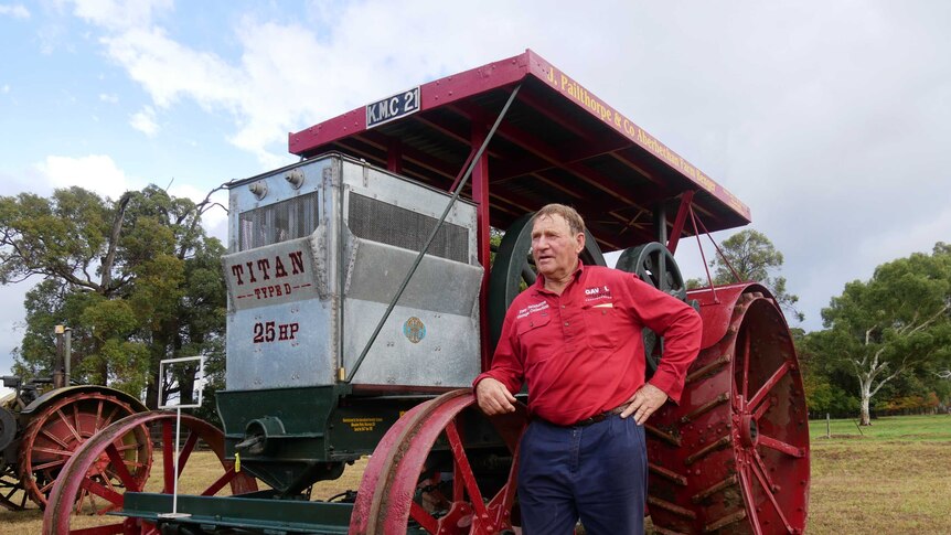 Bob Lukins stands next two a $190,000 tractor