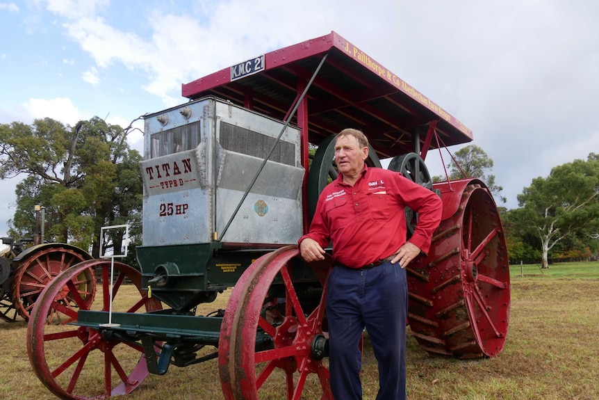 Bob Lukins stands next to a $ 190,000 tractor