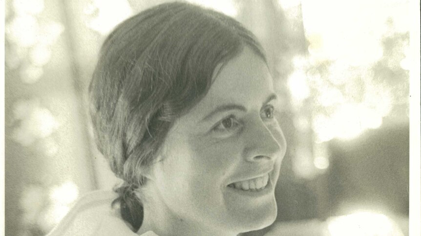 A black and white photo of a smiling Mary Garden on the day she left for India, in April 1973.