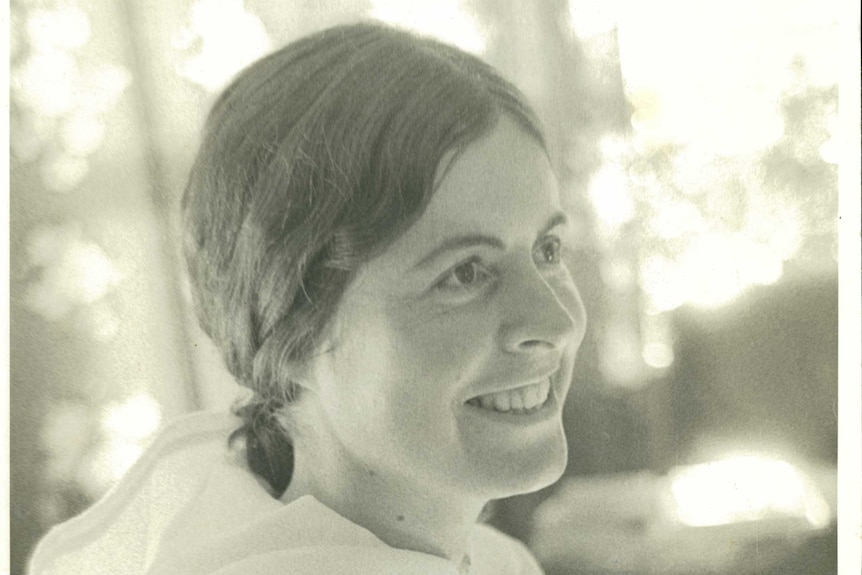 A black and white photo of a smiling Mary Garden on the day she left for India, in April 1973.