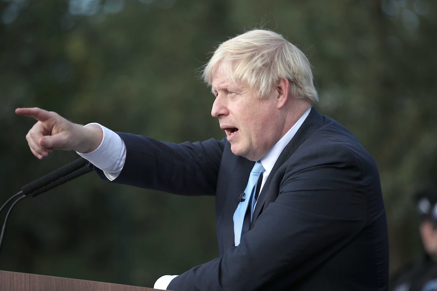 Boris Johnson points into the distance.