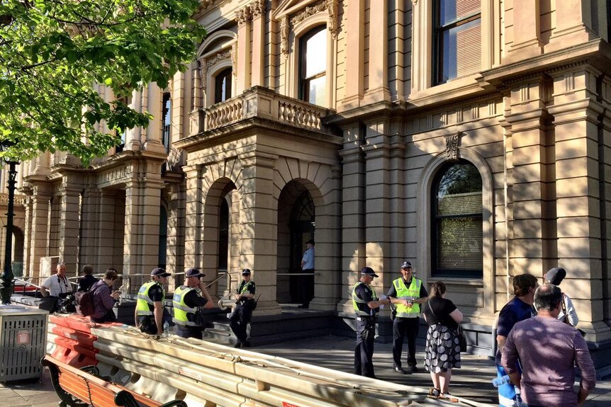 Police outside the Bendigo Town Hall in anticipation of anti-mosque protesters ahead of a council meeting.