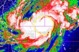 A red, green, blue and white satellite image of cyclone Mocha
