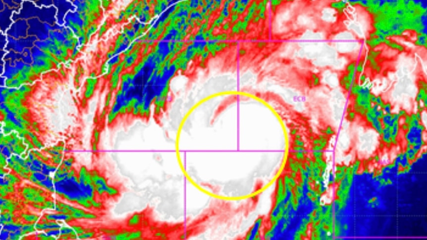 A red, green, blue and white satellite image of cyclone Mocha