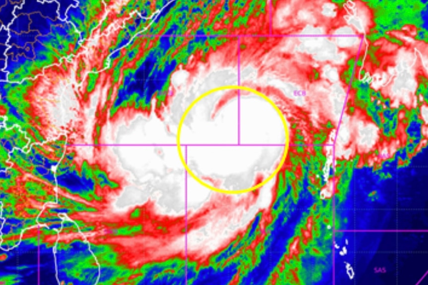 A red, green, blue and white satellite image of cyclone Mocha
