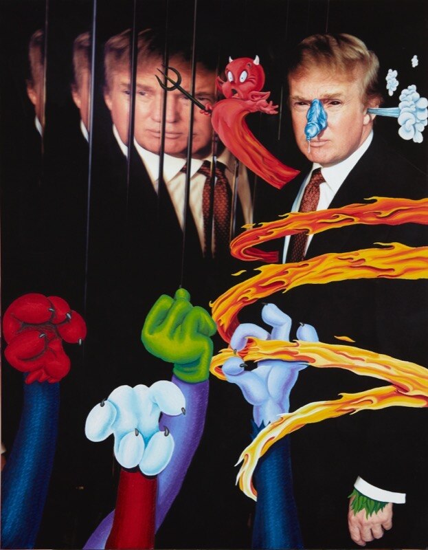 A photograph of Donald Trump has been adorned with painted cartoon characters