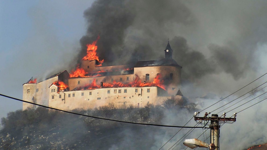 The Krasna Horka castle goes up in flames in the Slovakian village of Krasnohorske Podhradie