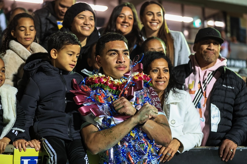 NRL debutant Lehi Hopoate, posing with his family after a win
