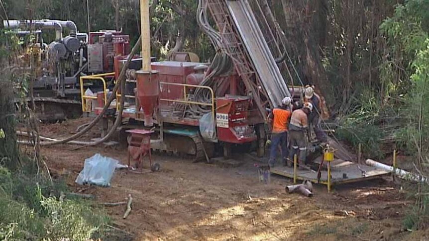 Shree Minerals workers operate an exploration rig in Tasmania's Tarkine region