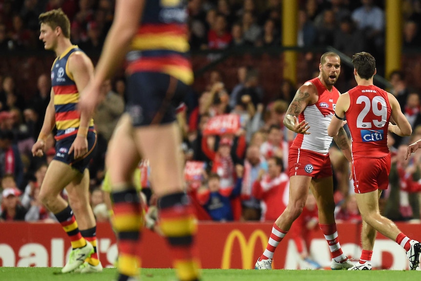 Lance Franklin of the Swans celebrates another goal with George Hewitt against the Adelaide Crows.