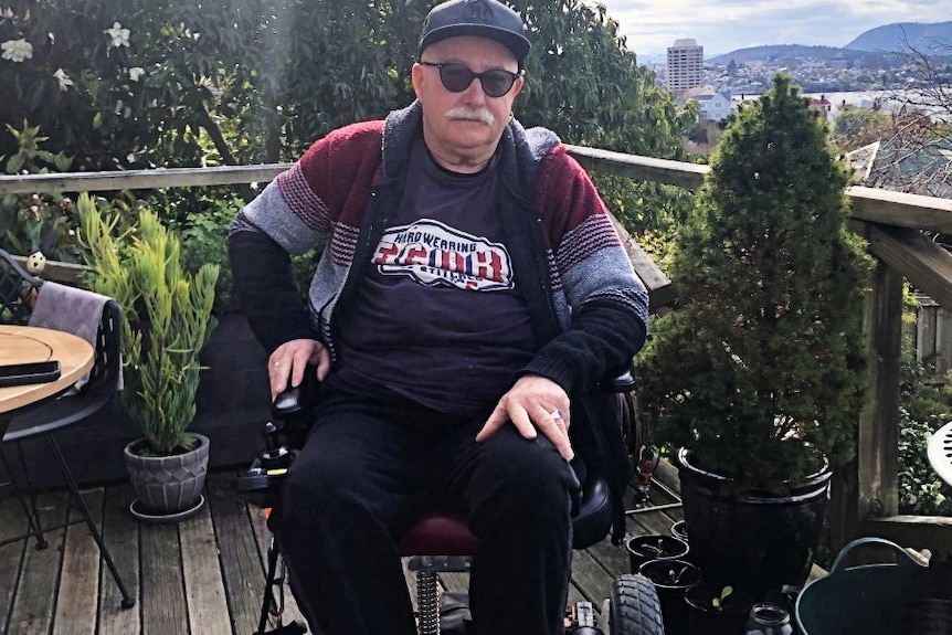 An older man sits in a mobility scooter on a deck. Ausnew Home Care, NDIS registered provider, My Aged Care