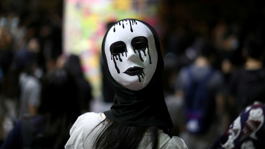 An anti-government protester wears a mask during a demonstration in Hong Kong.