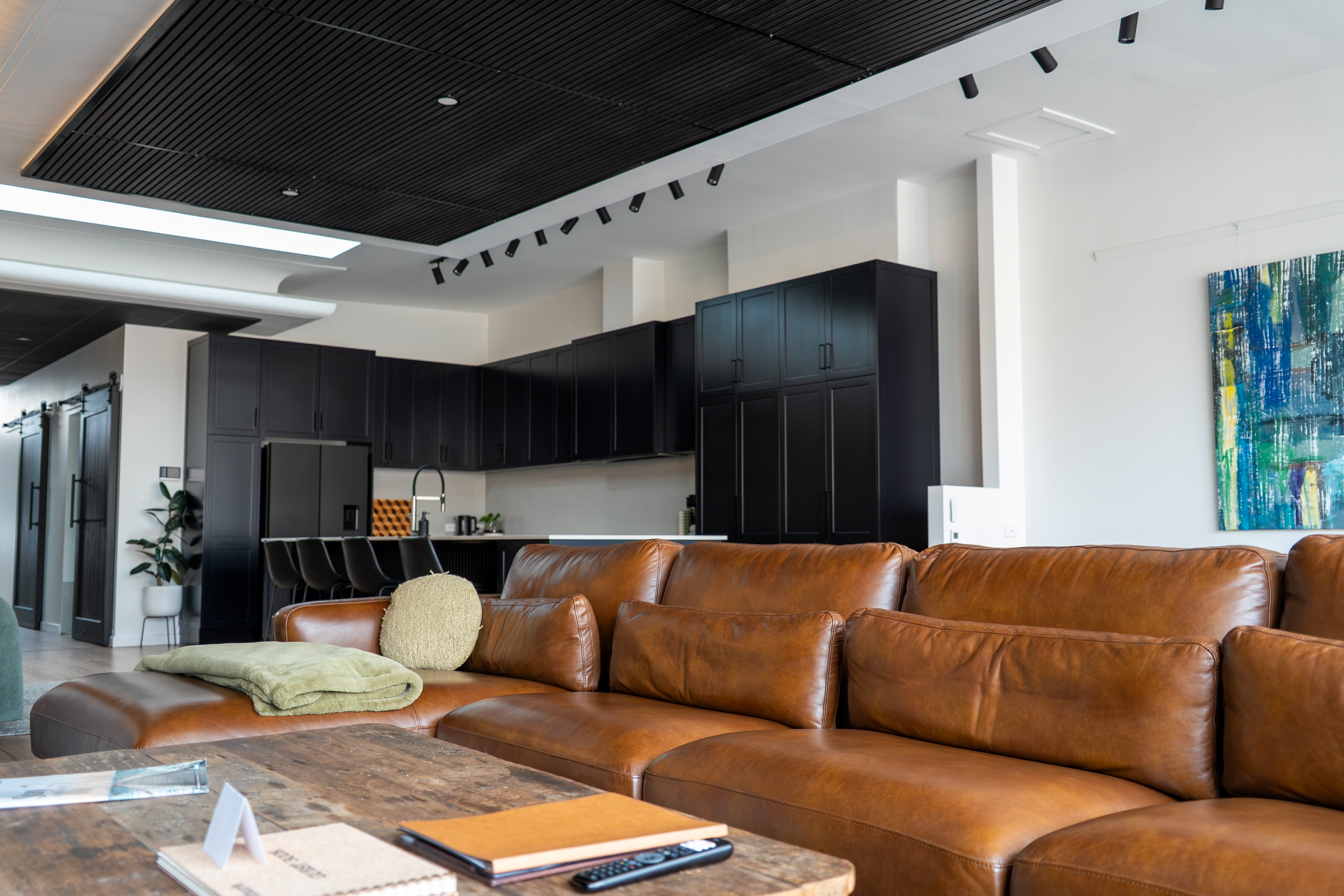a lounge, with a kitchen behind it