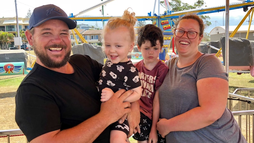 Rochelle Young and Darren Tierney with their children at the Port Macquarie carnival.