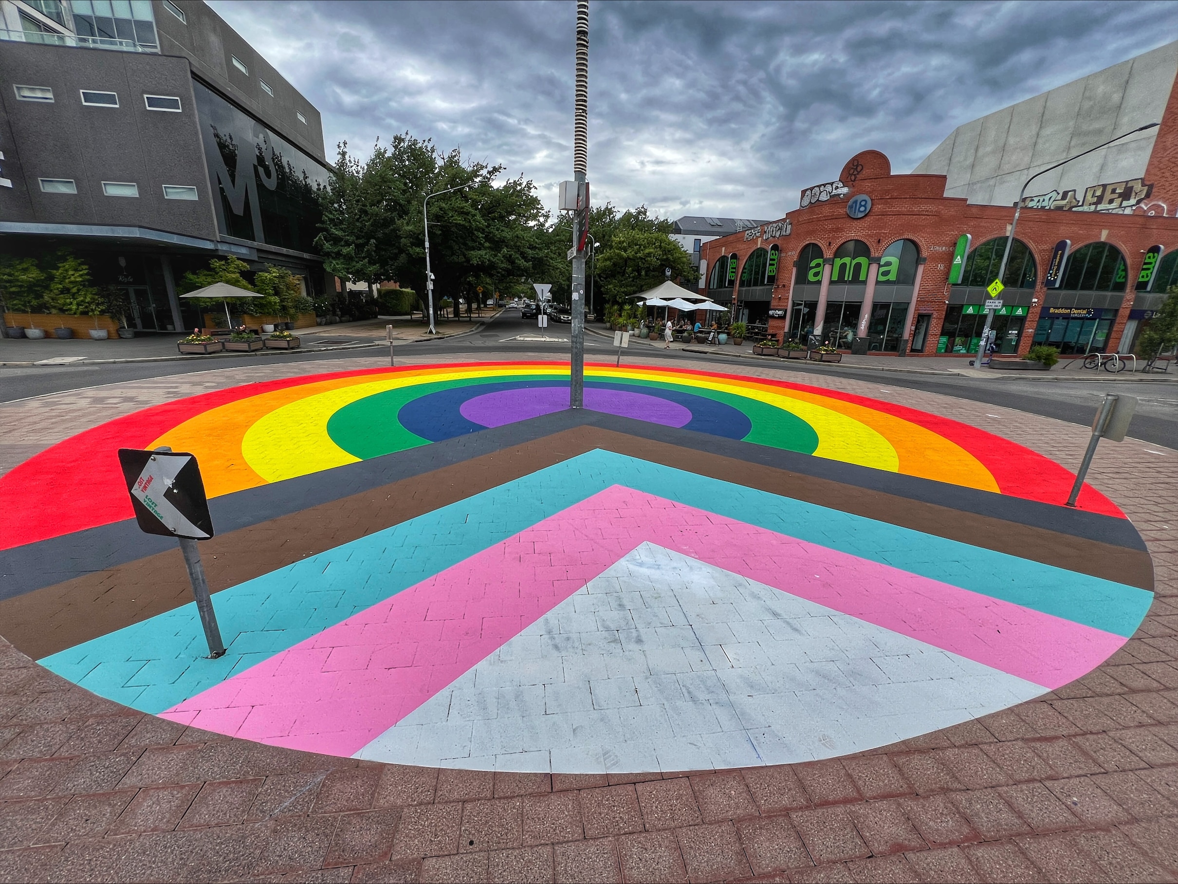A roundabout painted to represent the LGBTQI+ community.