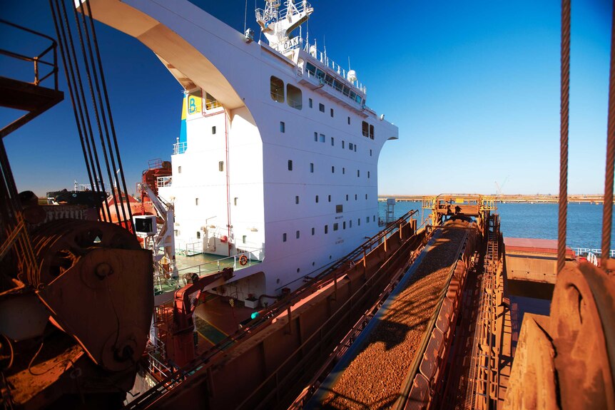 Iron ore being loaded onto a ship in Port Hedland