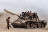 Militants loyal to Yemen's president Abd-Rabbu Mansour Hadi move a tank