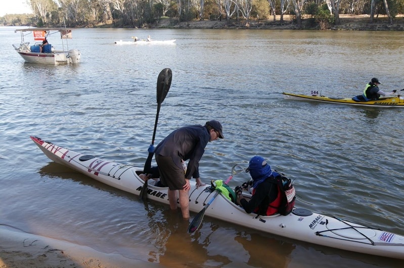 Kayakers may sure everything is ready on the Murray River
