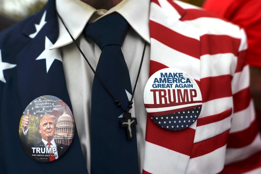 A Donald Trump supporter wearing US flag jacket