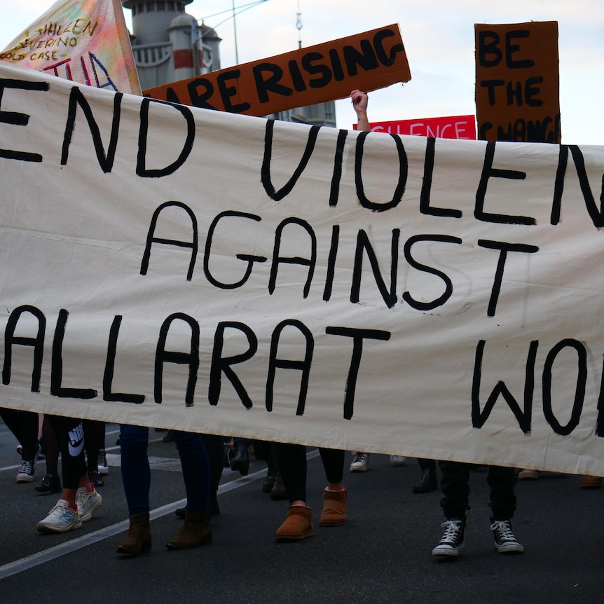 a banner says end violence against ballarat women