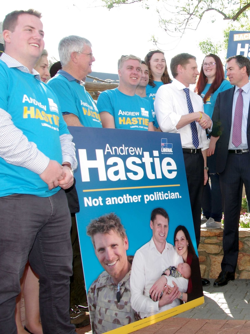 Andrew Hastie campaigning in the Canning by-election in September 2015, with material with him in SAS election.
