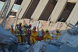 Rescuers bring out survivor from building which collapsed in Taiwan earthquake